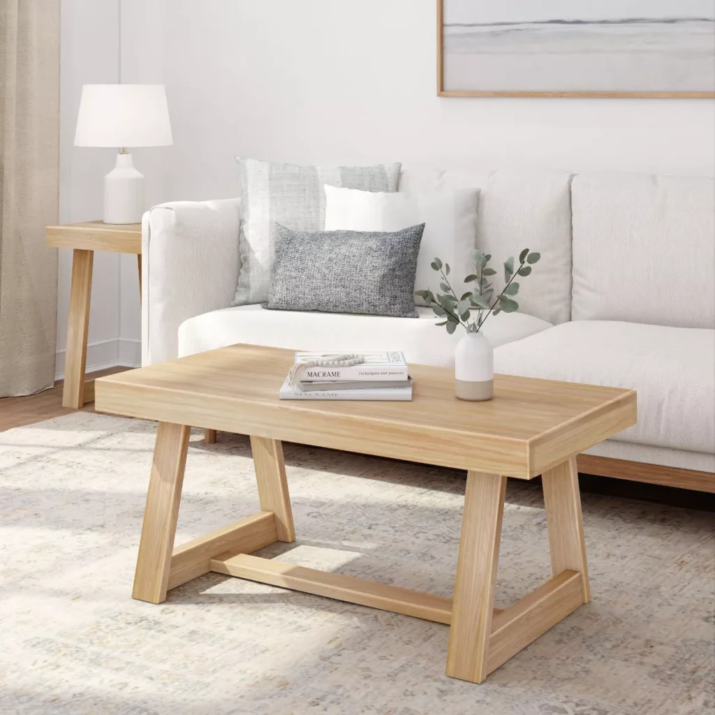 Blonde, solid wood, rectangular farmhouse coffee table.